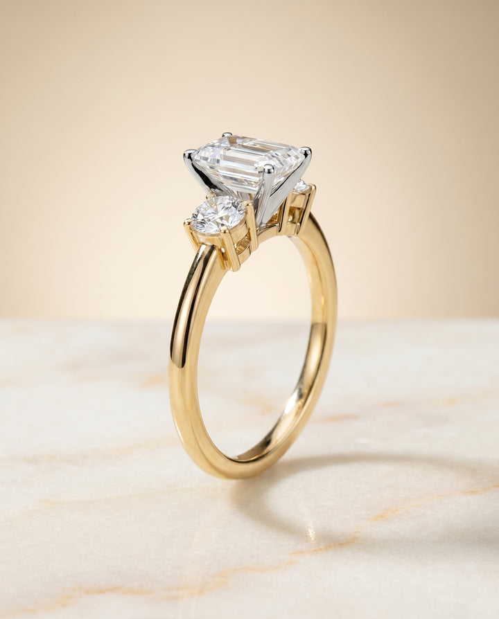 The Anita Three Stone Engagement Ring Setting for Emerald Cut Diamonds in 18K Yellow Gold