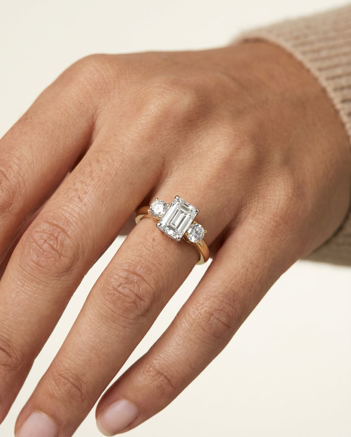 Anita Select Three Stone Emerald Cut Lab Diamond Engagement Ring in 18K Yellow Gold, shown on hand | RockHer