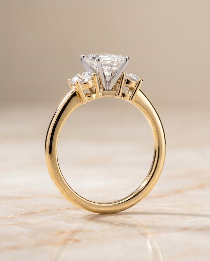 The Anita Three Stone Engagement Ring Setting for Emerald Cut Diamonds in 18K Yellow Gold