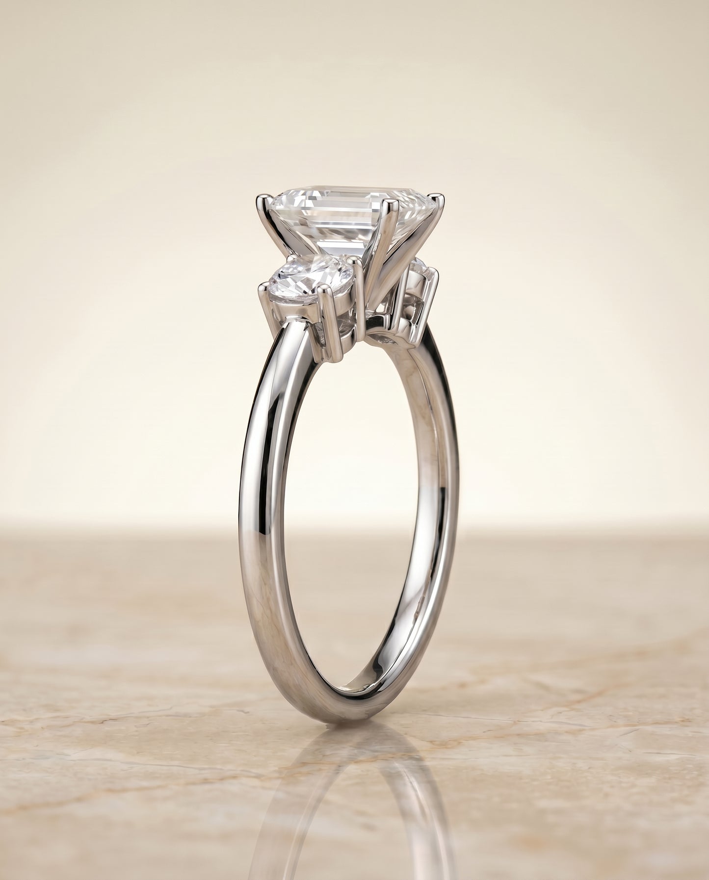 The Anita Three Stone Engagement Ring Setting for Emerald Cut Diamonds in 18K White Gold