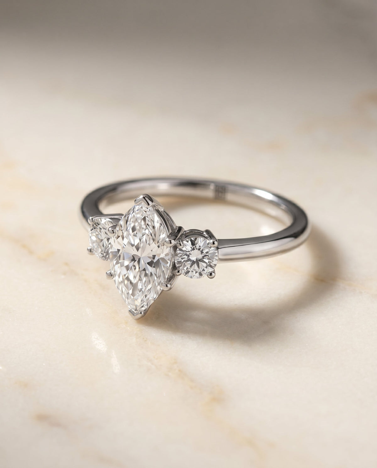 Anita Select Three Stone Marquise Lab Diamond Engagement Ring in Platinum, shown on hand, angled | RockHer