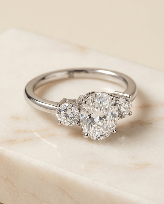 Anita Select Three Stone Oval Lab Diamond Engagement Ring in Platinum, shown on hand, angled | RockHer