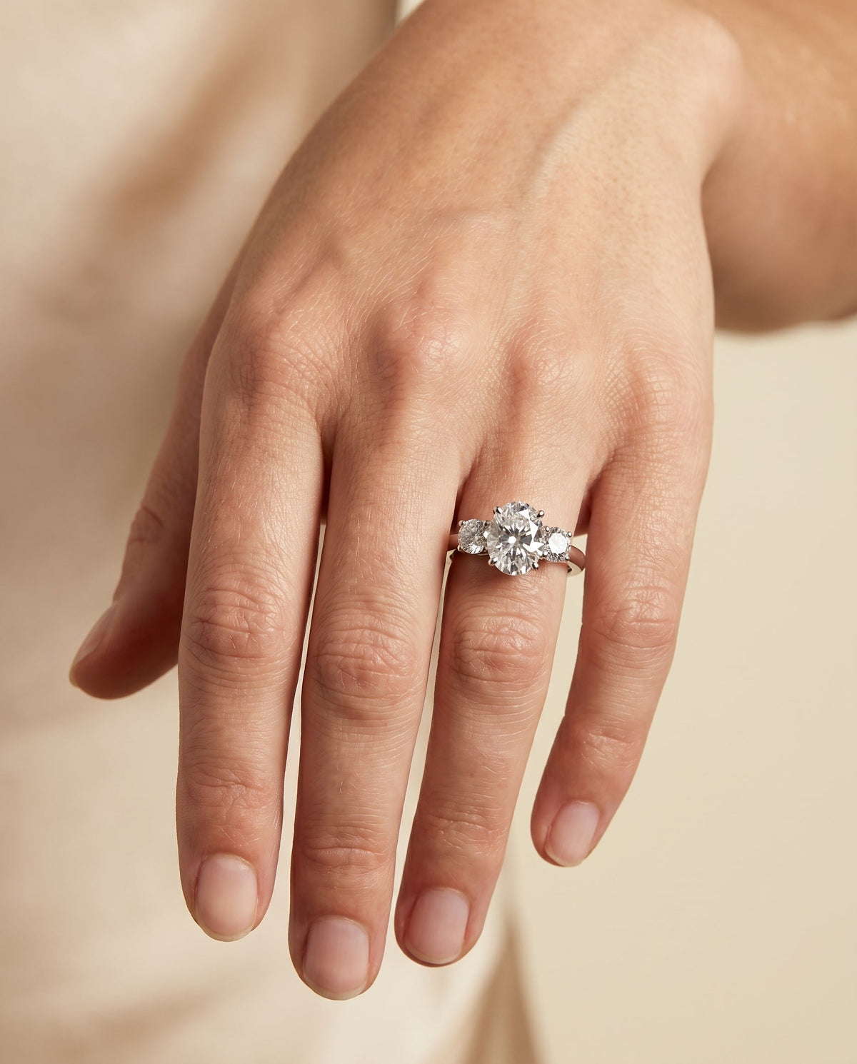 Anita Select Three Stone Oval Lab Diamond Engagement Ring in 18K White Gold, shown on hand | RockHer