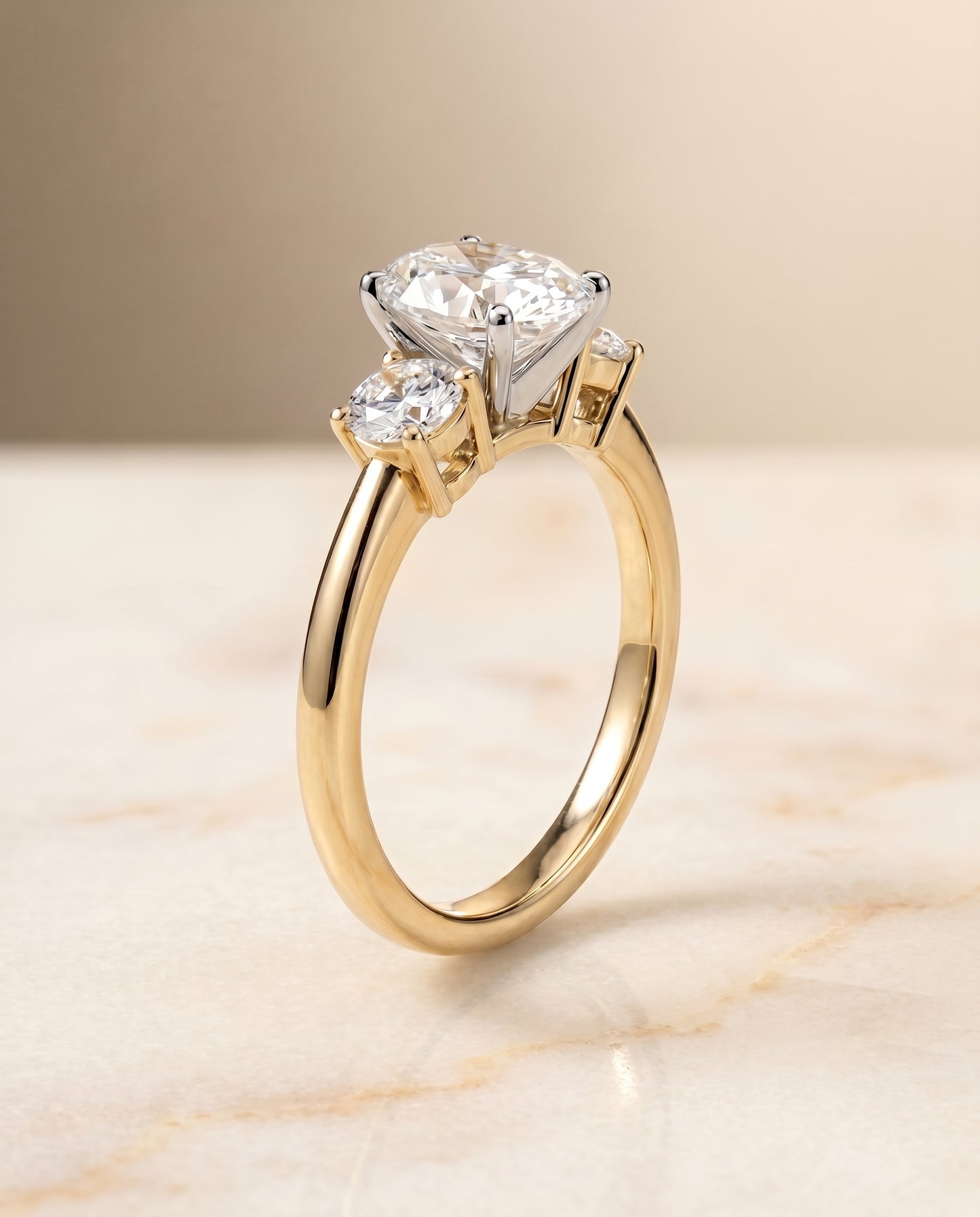The Anita Three Stone Engagement Ring Setting for Oval Diamonds in 18K Yellow Gold