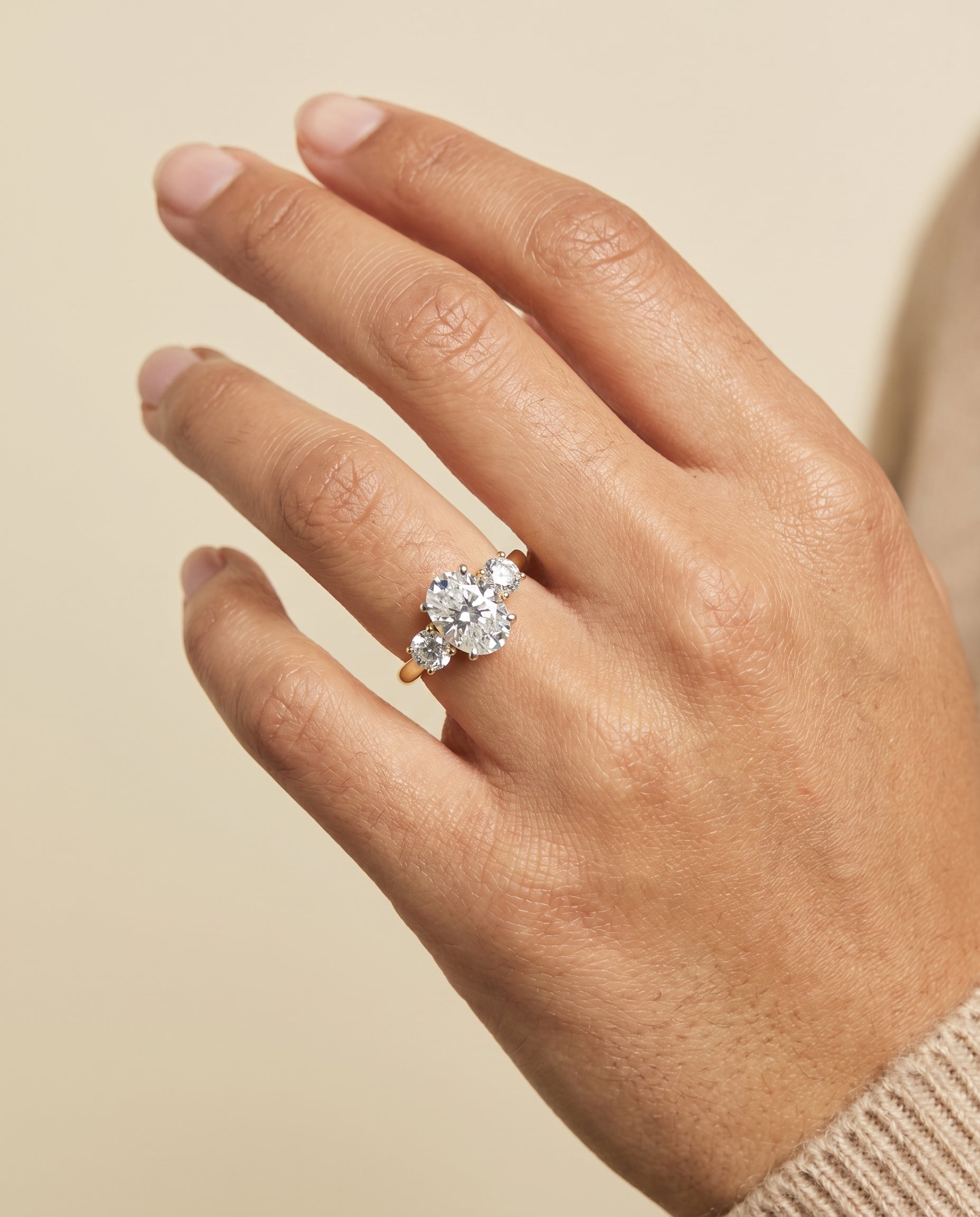 Anita Select Classic Three Stone Oval Lab Diamond Engagement Ring in 18K Yellow Gold, shown on hand | RockHer