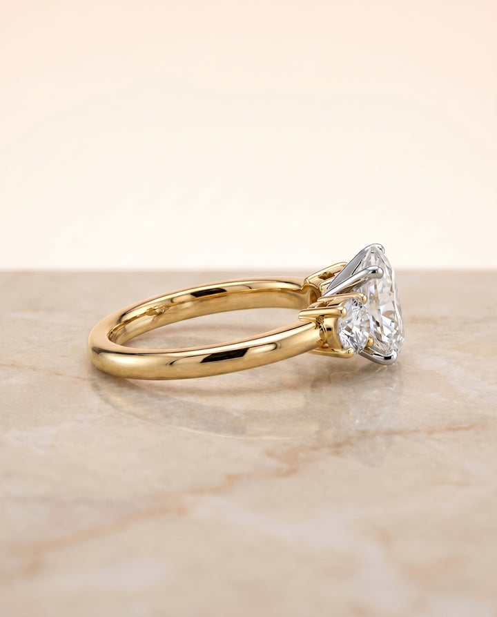 The Anita Three Stone Engagement Ring Setting for Oval Diamonds in 18K Yellow Gold
