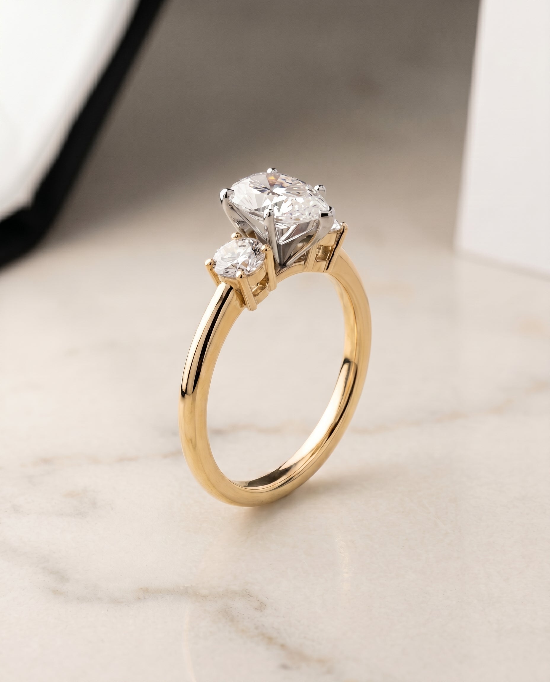 Classic Three Stone styling on The Anita pear engagement ring setting | RockHer