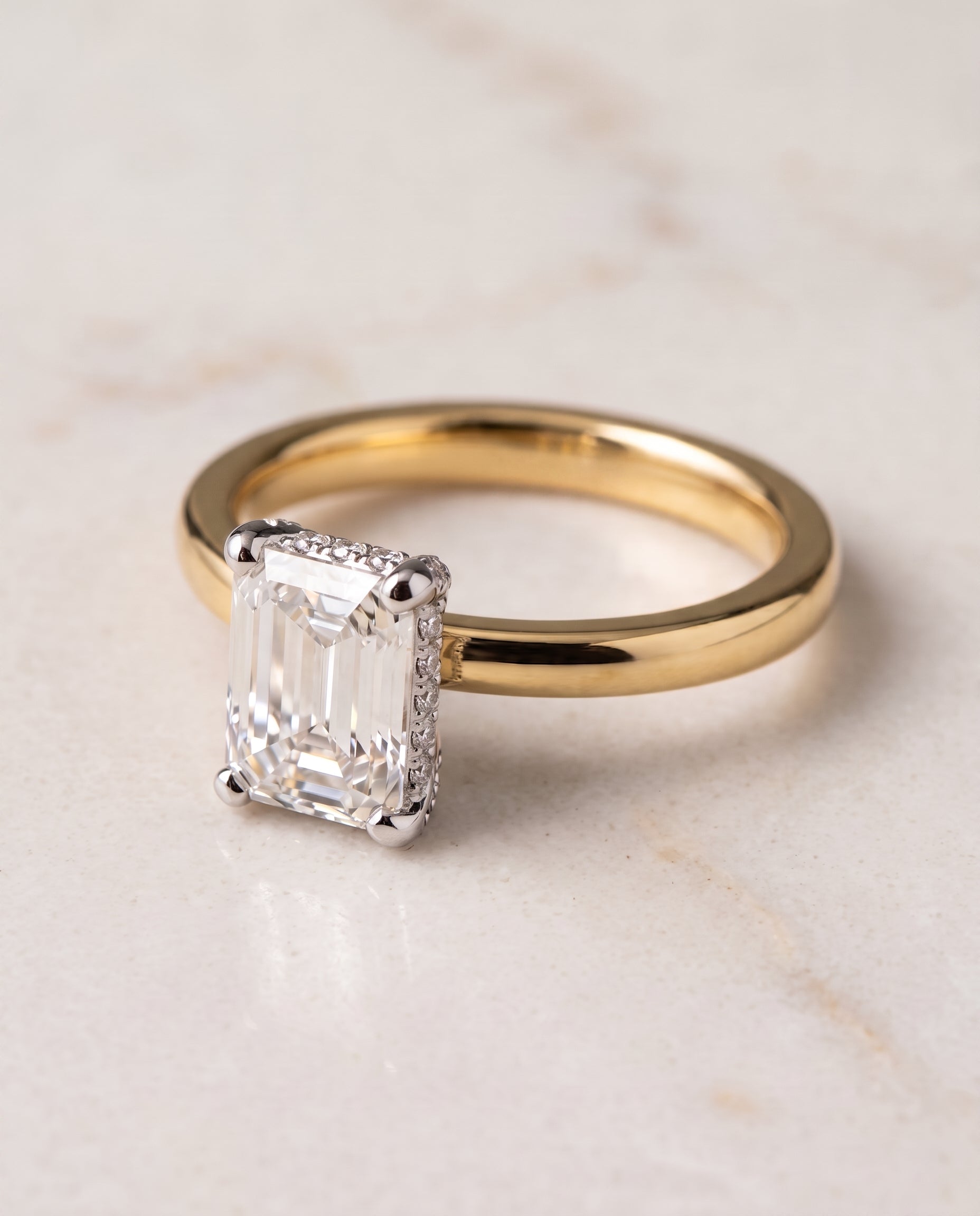 The Annabelle Hidden Pavé Basket Crown Solitaire Emerald Cut Engagement Ring Setting in 18K Yellow Gold