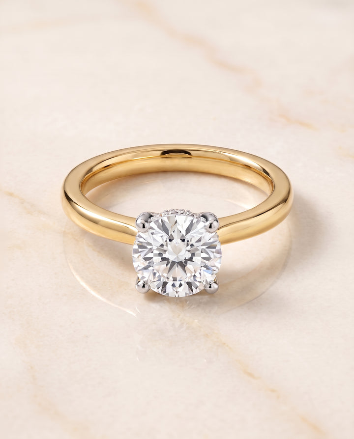 The Annabelle Hidden Pavé Basket Crown Solitaire Round Engagement Ring Setting in 18K Yellow Gold