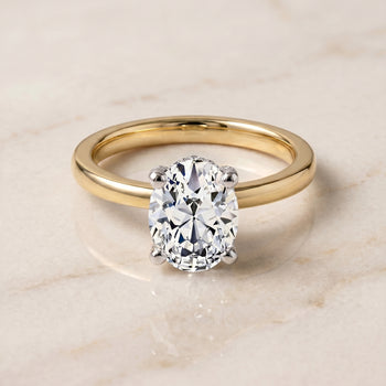 The Annabelle Hidden Pavé Basket Crown Solitaire Oval Engagement Ring Setting in 18K Yellow Gold