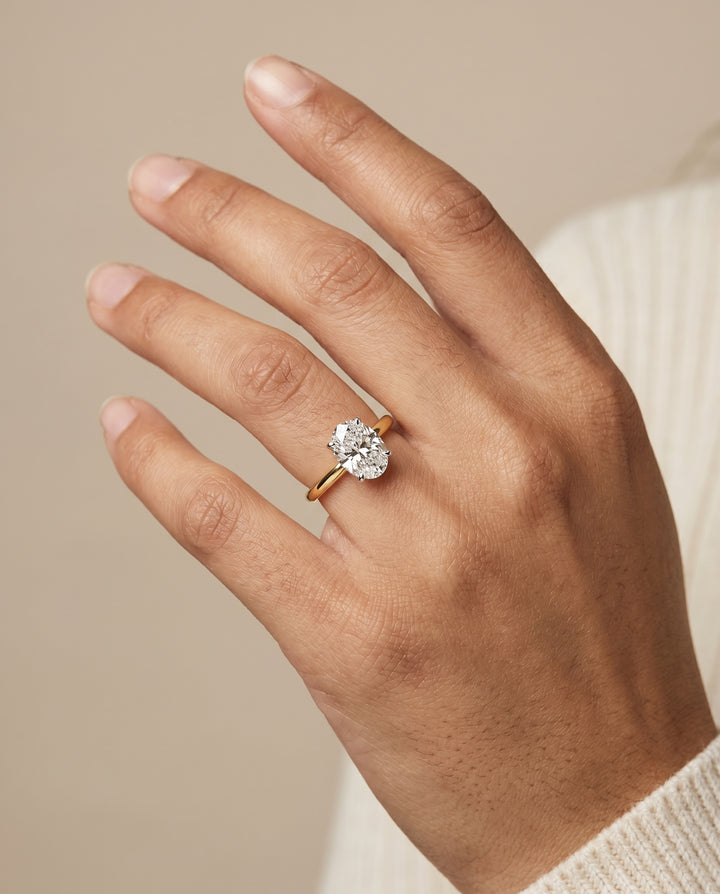 The Annabelle Hidden Pavé Basket Crown Solitaire Oval Engagement Ring Setting in 18K Yellow Gold
