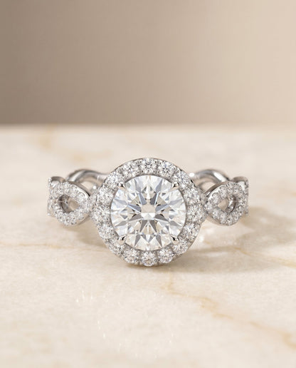 Annie Select Halo Round Lab Diamond Engagement Ring in Platinum, shown on hand, angled | RockHer