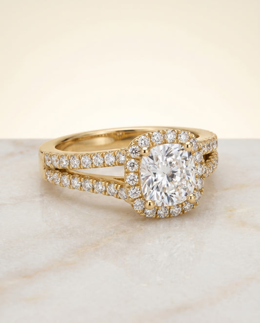 The Aretha Pavé Halo Split Shank Engagement Ring Setting for Cushion Diamonds in 18K Yellow Gold
