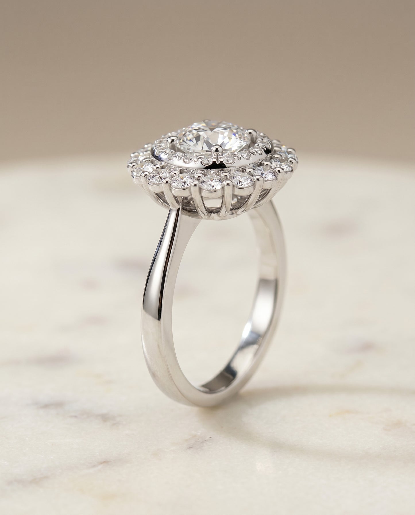 Round Brilliant, Double Halo Sunburst, in Platinum, pave setting – front view | RockHer