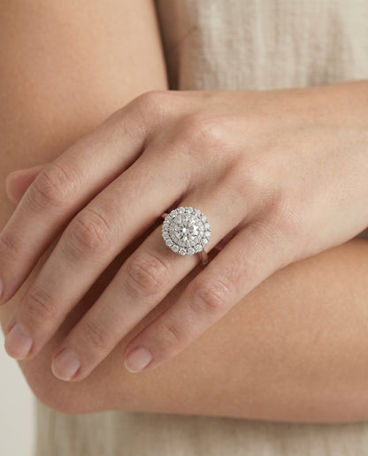 Arietta Select Double Halo Round Lab Diamond Engagement Ring in 18K White Gold, shown on hand, angled | RockHer