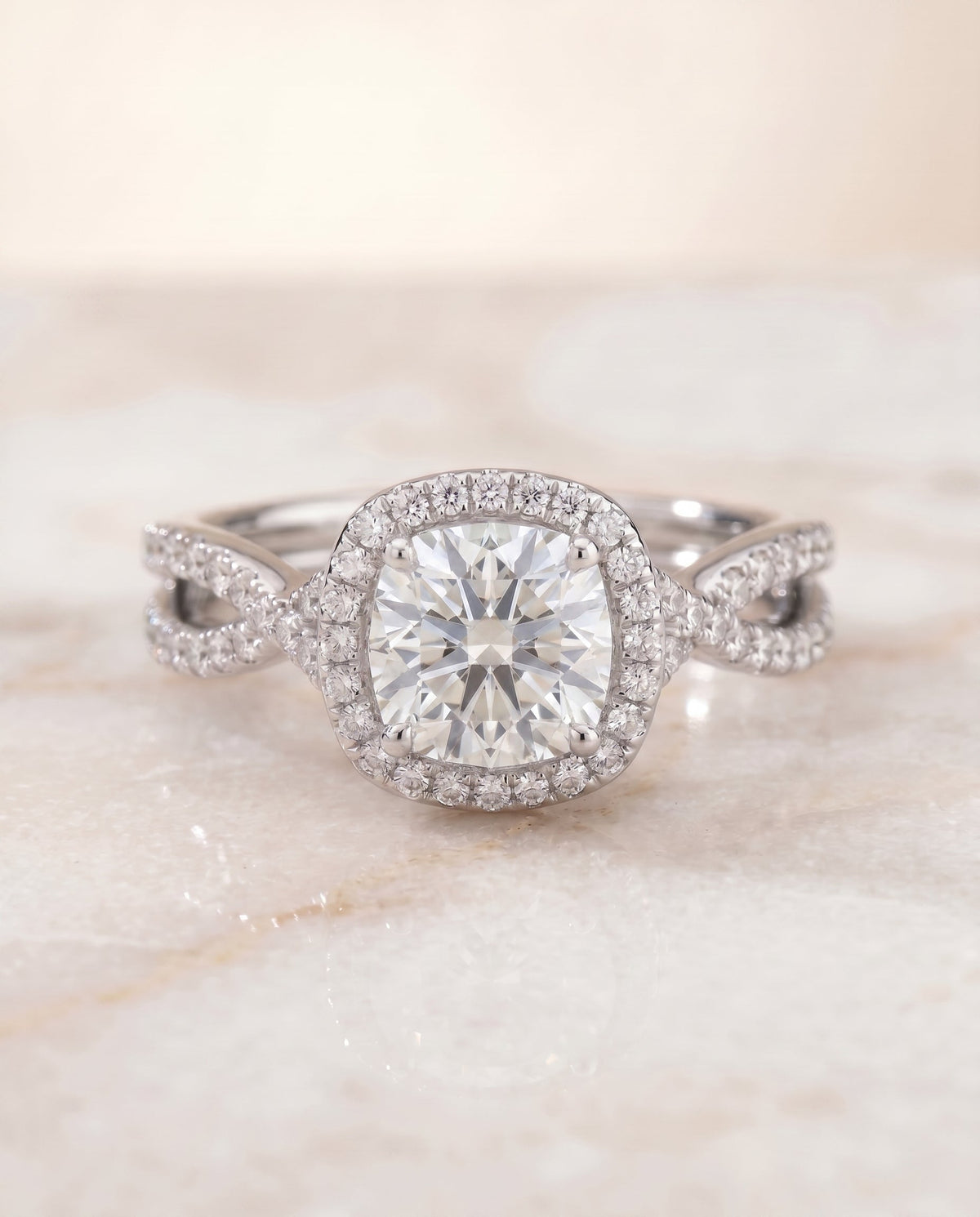 Audra Select Twisted Scalloped Pavé Halo Cushion Cut Lab Diamond Engagement Ring in Platinum, shown on hand, angled | RockHer