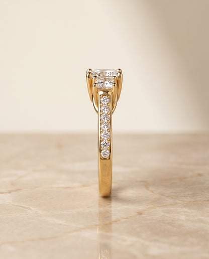The Avery Channel Pavé Three Stone Princess Cut Engagement Ring Setting in 18K Yellow Gold