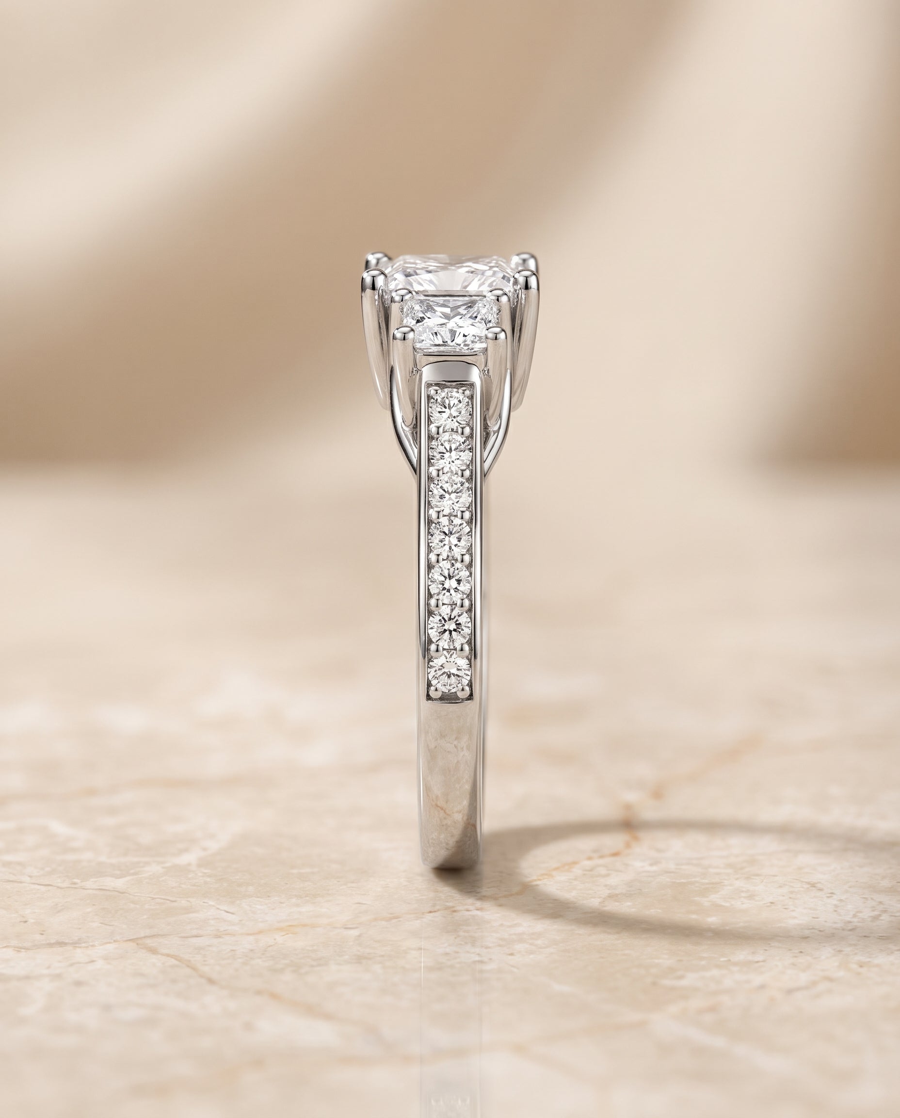 The Avery Channel Pavé Three Stone Princess Cut Engagement Ring Setting in Platinum