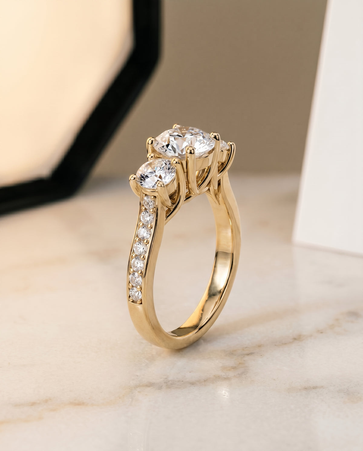 Channel Pavé Three Stone styling on The Avery round engagement ring setting | RockHer