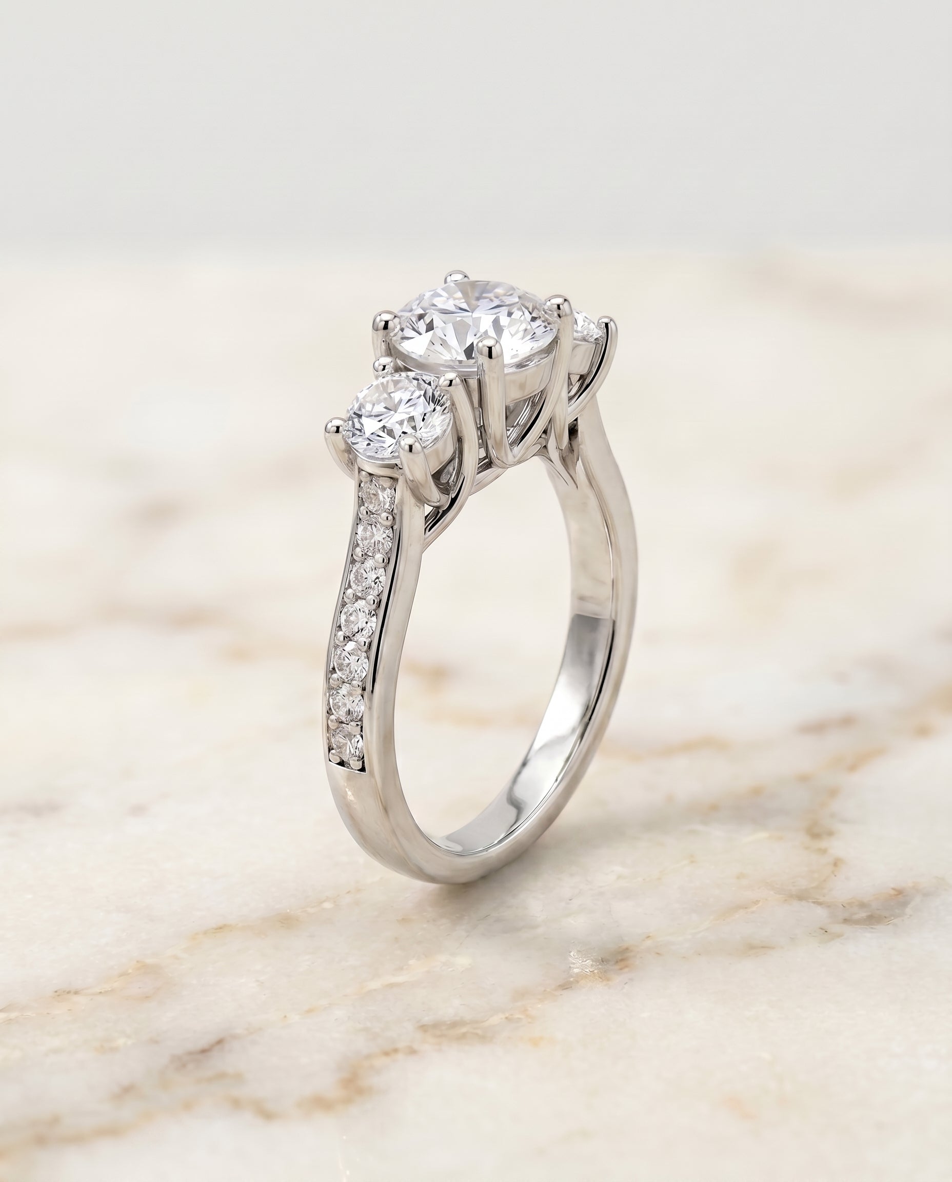 Channel Pavé Three Stone styling on The Avery round engagement ring setting | RockHer