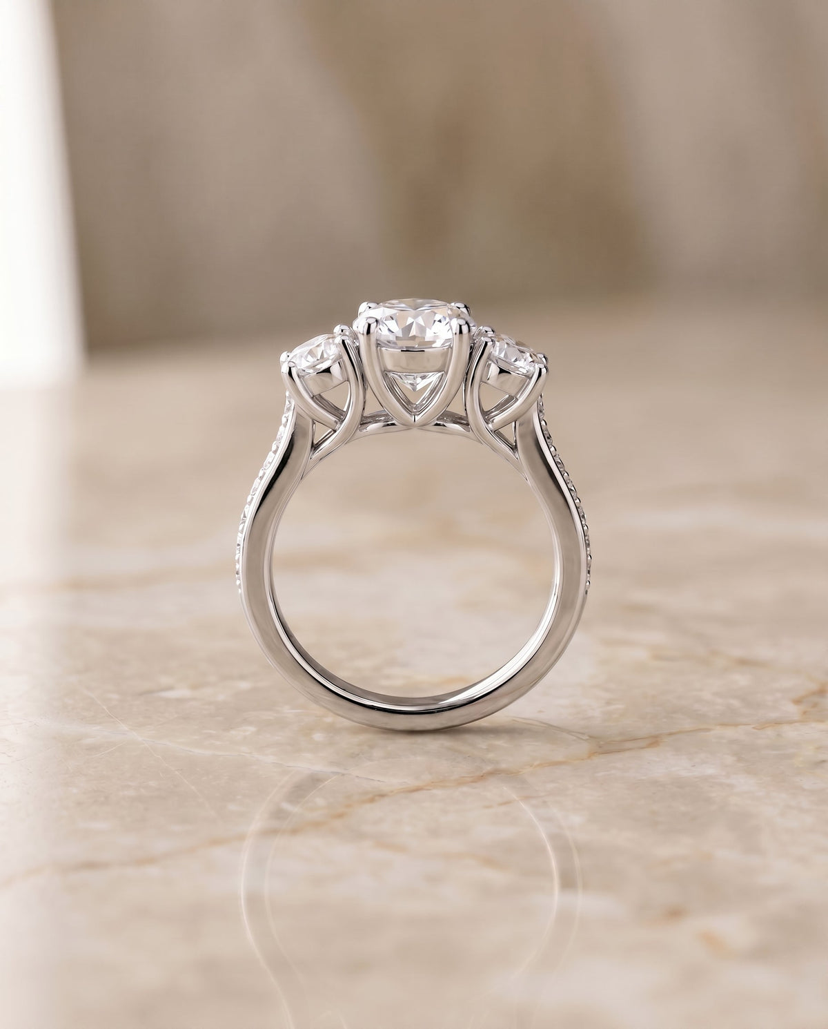 Avery Select Three Stone Round Lab Diamond Engagement Ring in Platinum, side view | RockHer