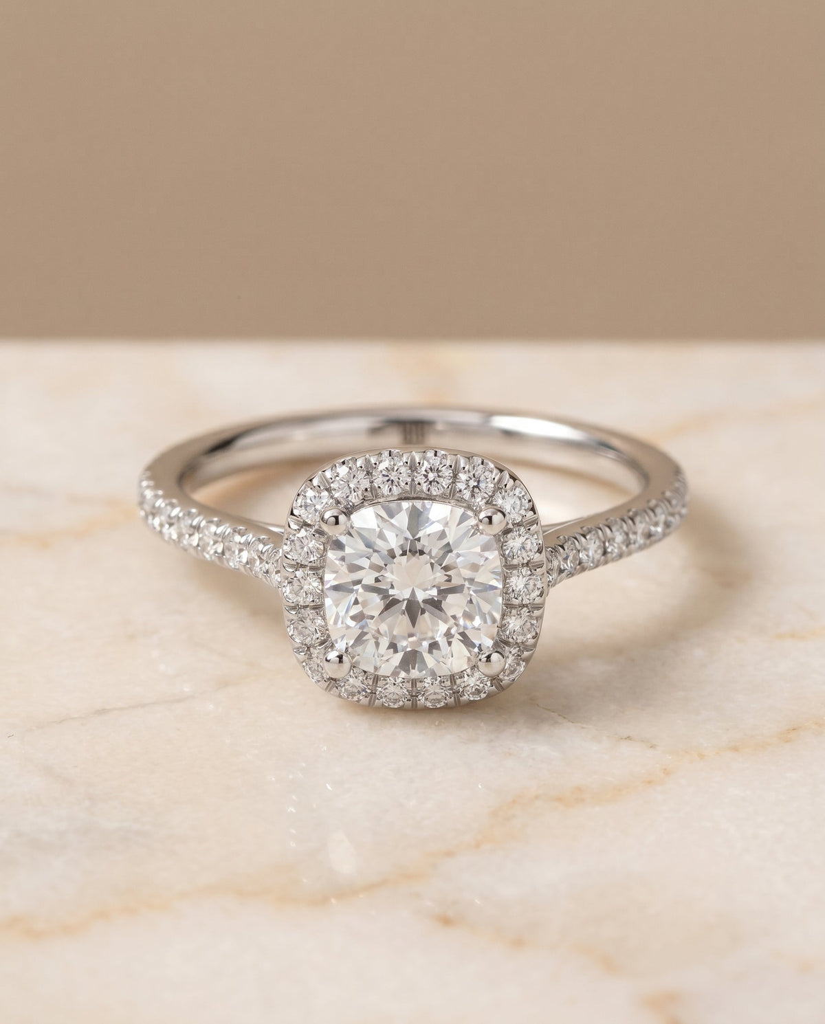 Bianca Select Halo Cushion Cut Lab Diamond Engagement Ring in Platinum, shown on hand, angled | RockHer