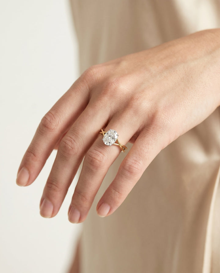 Blondie Select Double Hidden Halo Solitaire Oval Lab Diamond Engagement Ring in 14K Yellow Gold, shown on hand, angled | RockHer