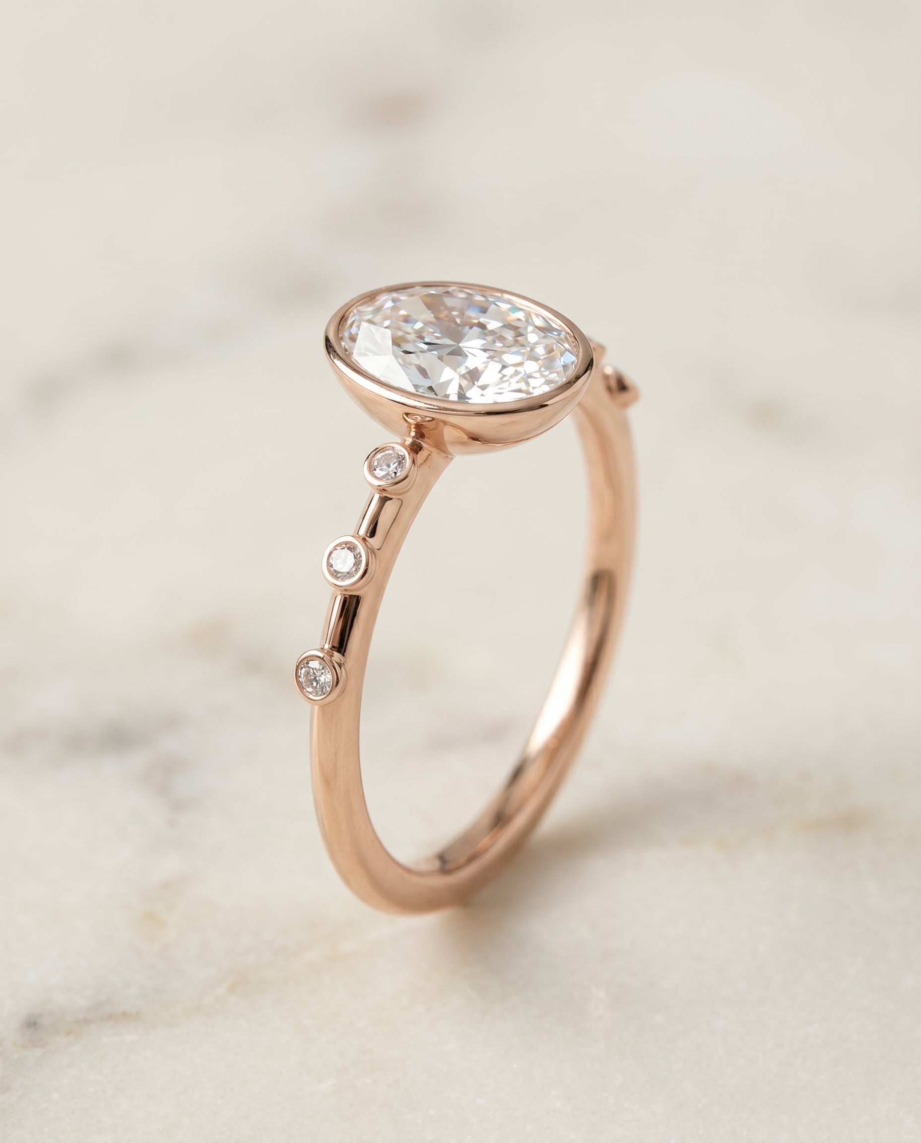 Bezel Accent Solitaire styling on The Brandi oval engagement ring setting | RockHer