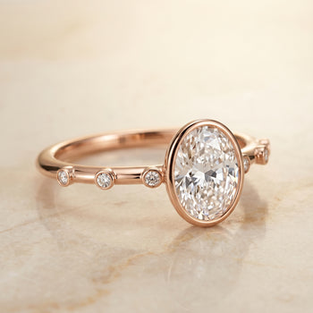 The Brandi Bezel Accent Solitaire Oval Engagement Ring Setting in 14K Rose Gold