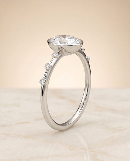 The Brandi Bezel Accent Solitaire Oval Engagement Ring Setting in Platinum