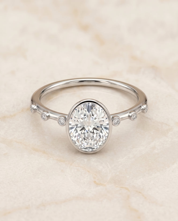 The Brandi Bezel Accent Solitaire Oval Engagement Ring Setting in 18K White Gold