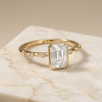 The Brandi Bezel Accent Solitaire Radiant Cut Engagement Ring Setting in 18K Yellow Gold