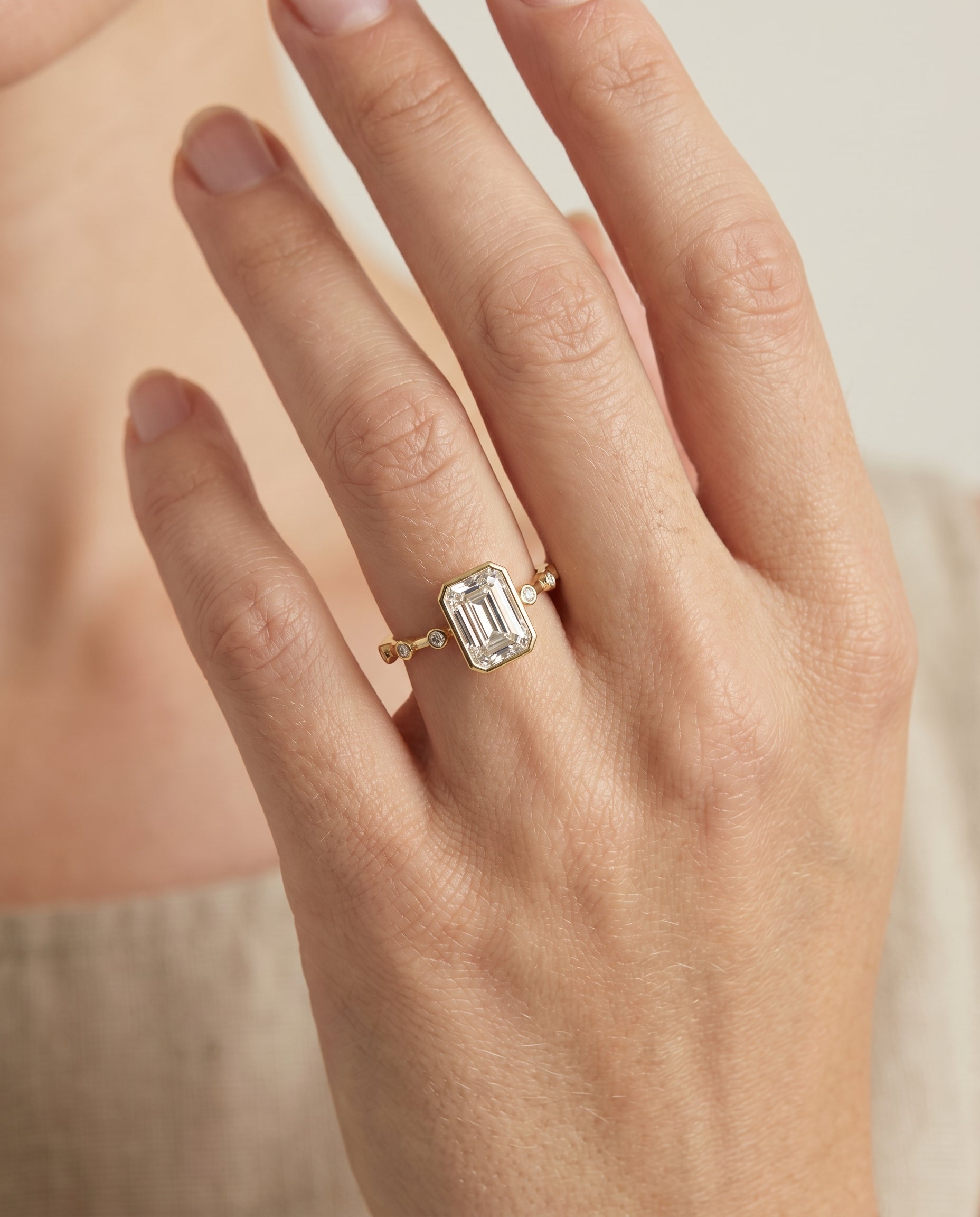 The Brandi engagement ring setting in 18K Yellow Gold, bezel accent solitaire cut design | RockHer