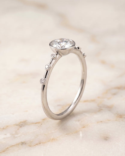 Brandi Select Bezel Accent Solitaire Round Lab Diamond Engagement Ring in Platinum, front view | RockHer