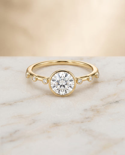 The Brandi Bezel Accent Solitaire Round Engagement Ring Setting in 18K Yellow Gold