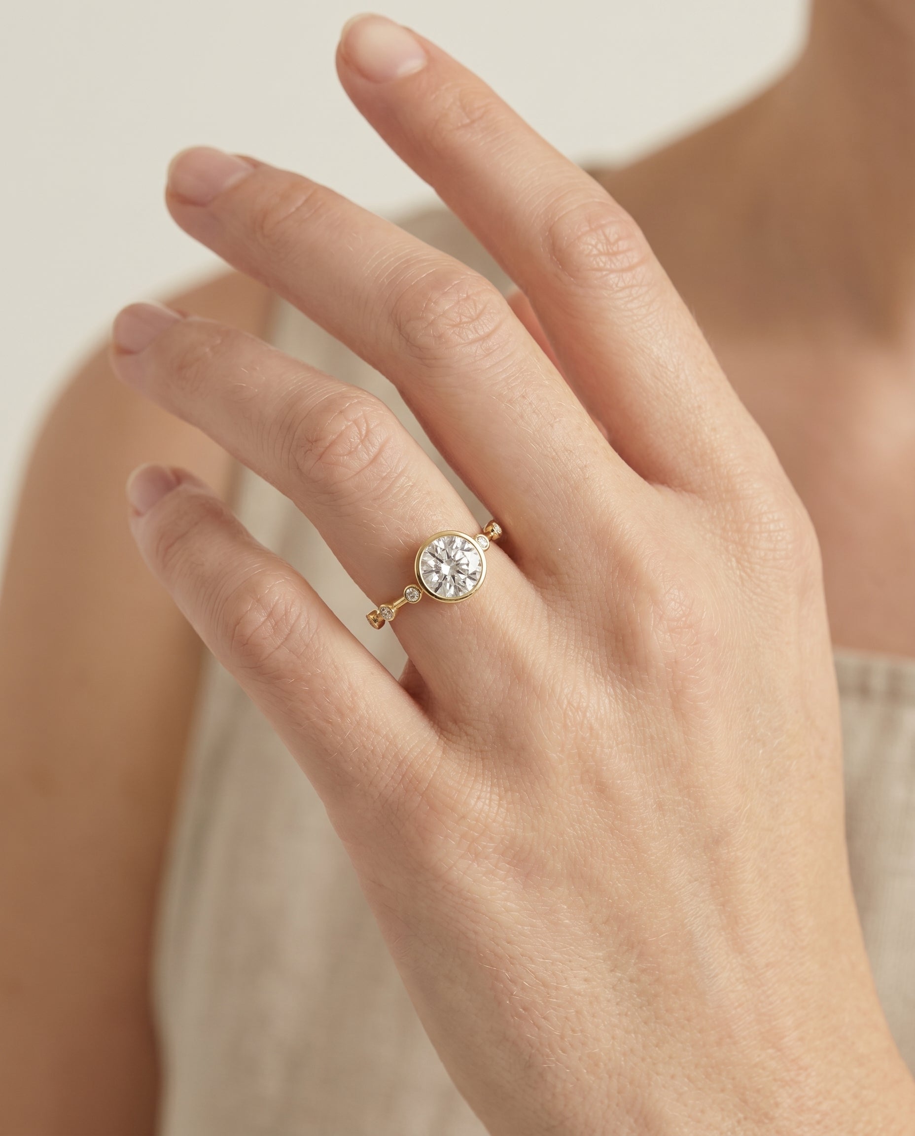The Brandi engagement ring setting in 18K Yellow Gold, bezel accent solitaire design | RockHer