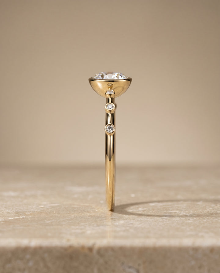 The Brandi Bezel Accent Solitaire Round Engagement Ring Setting in 18K Yellow Gold