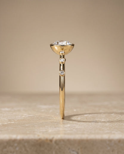 Brandi Select Solitaire Round Lab Diamond Engagement Ring in 18K Yellow Gold, side view | RockHer