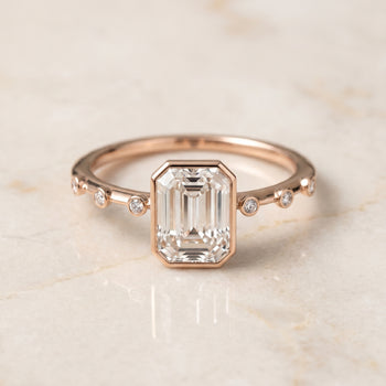 The Brandi Bezel Accent Solitaire Emerald Cut Engagement Ring Setting in 14K Rose Gold