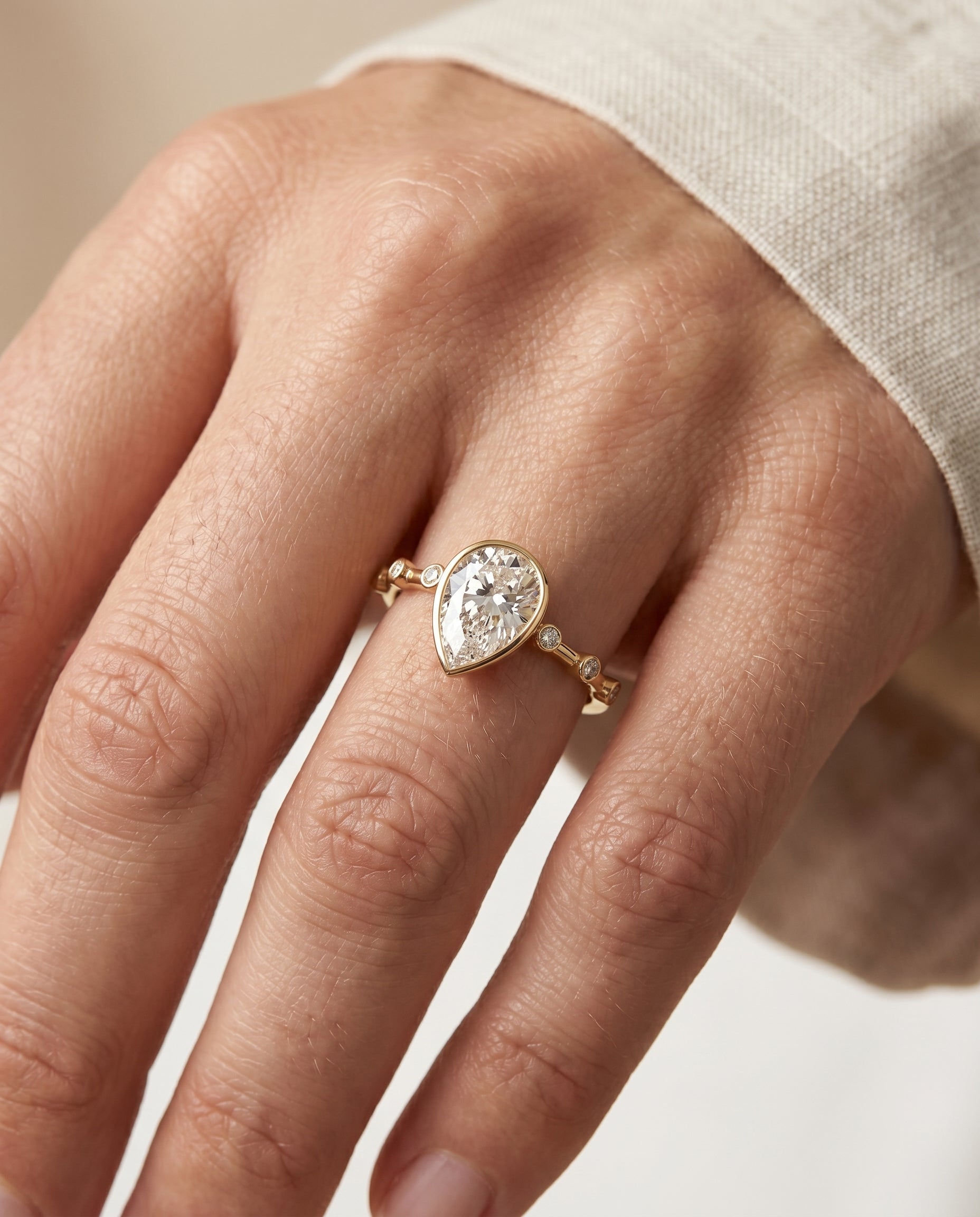 The Brandi engagement ring setting in 18K Yellow Gold, bezel accent solitaire design | RockHer