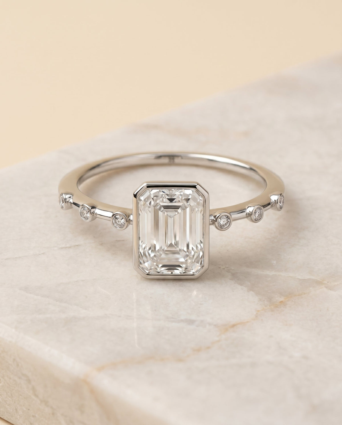 Brandi Select Solitaire Radiant Cut Lab Diamond Engagement Ring in Platinum, shown on hand, angled | RockHer