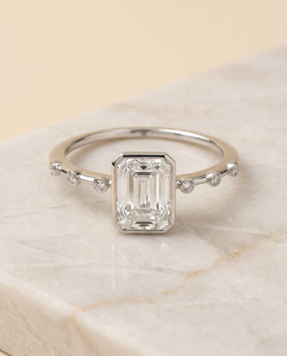 Brandi Select Solitaire Radiant Cut Lab Diamond Engagement Ring in Platinum, shown on hand, angled | RockHer