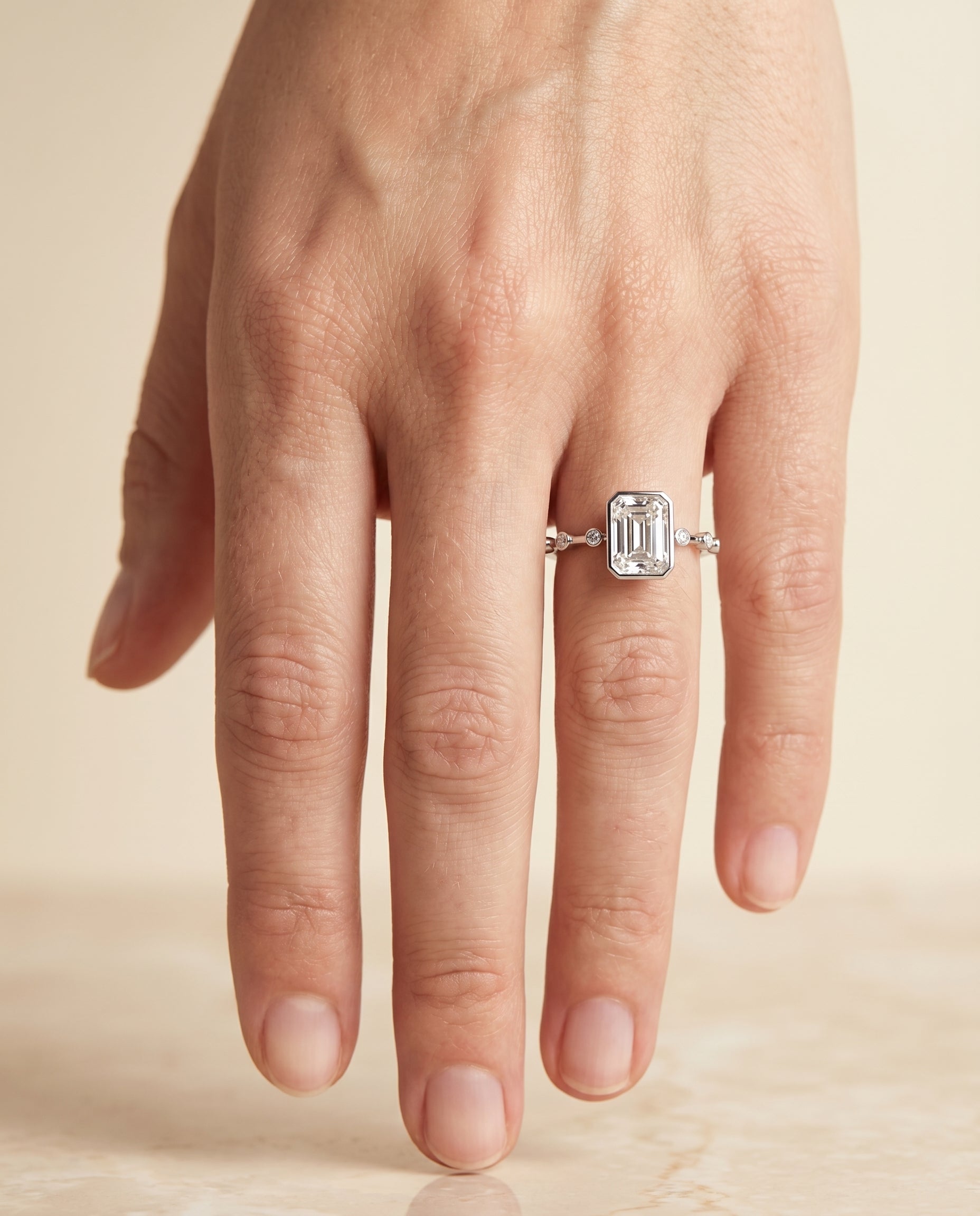 The Brandi engagement ring setting in Platinum, bezel accent solitaire cut design | RockHer