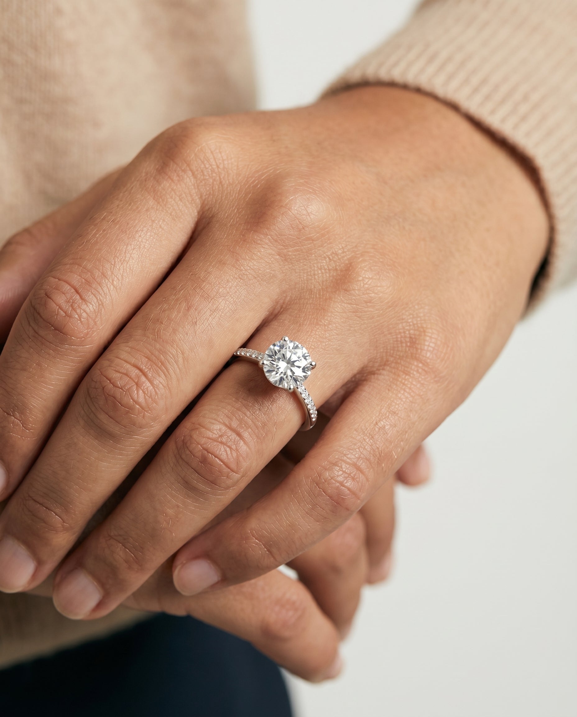 Brenda Select High Hidden Halo Solitaire Round Lab Diamond Engagement Ring in 18K White Gold, shown on hand, angled | RockHer