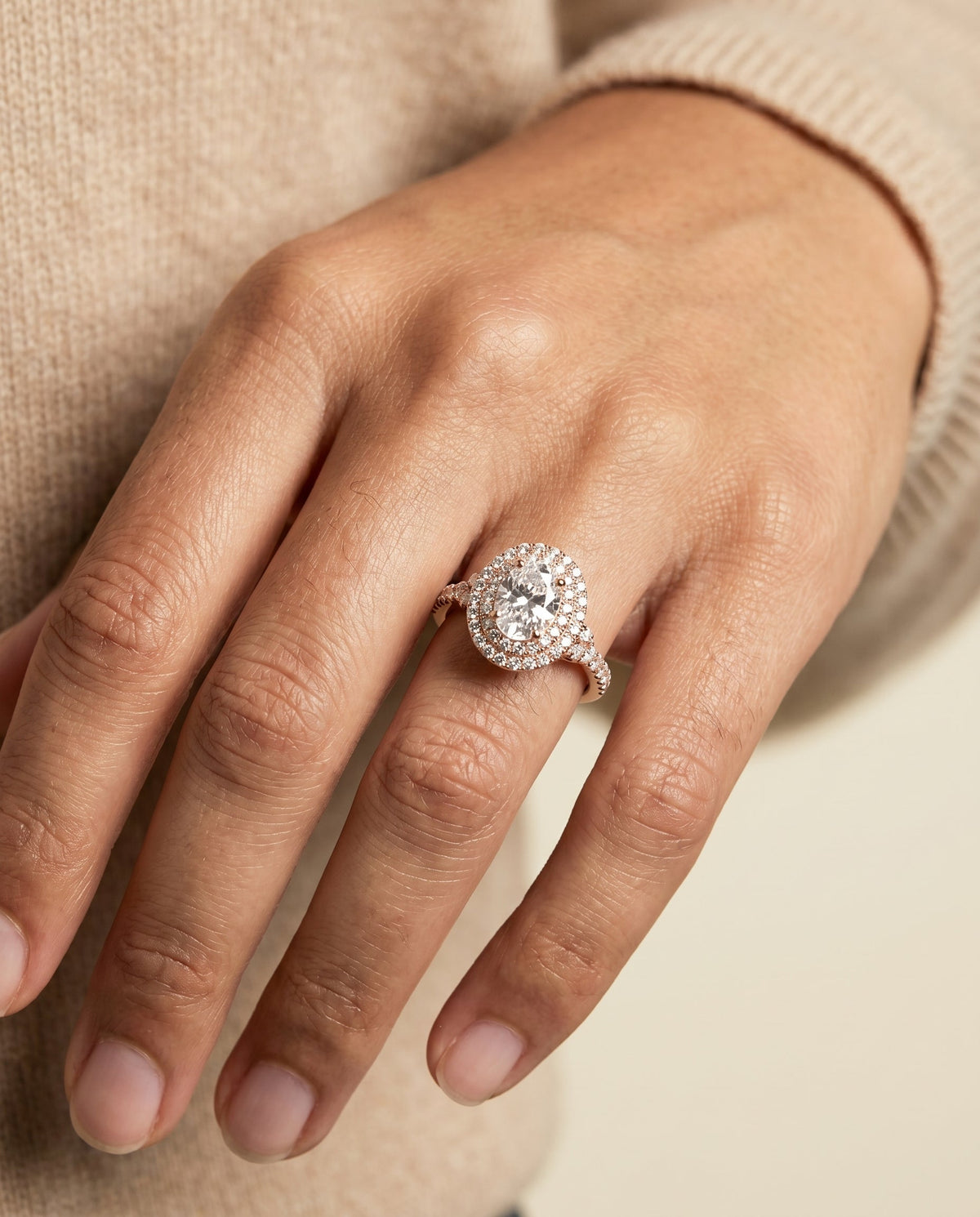 Britney Select Double Halo Oval Lab Diamond Engagement Ring in 14K Rose Gold, shown on hand | RockHer