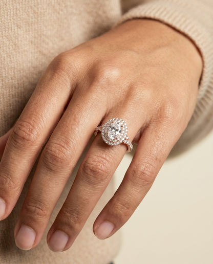 Britney Select Double Halo Oval Lab Diamond Engagement Ring in 14K Rose Gold, shown on hand | RockHer