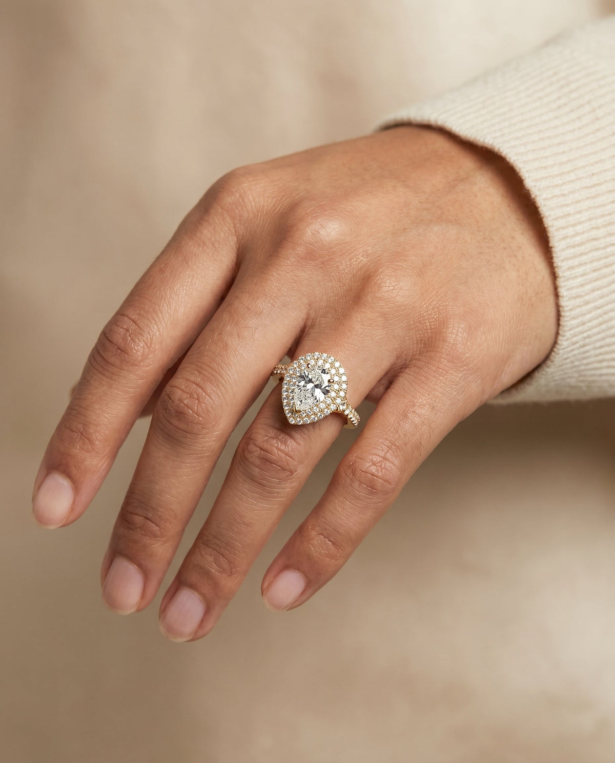 Britney Select Double Halo Pear Lab Diamond Engagement Ring in 18K Yellow Gold, shown on hand | RockHer