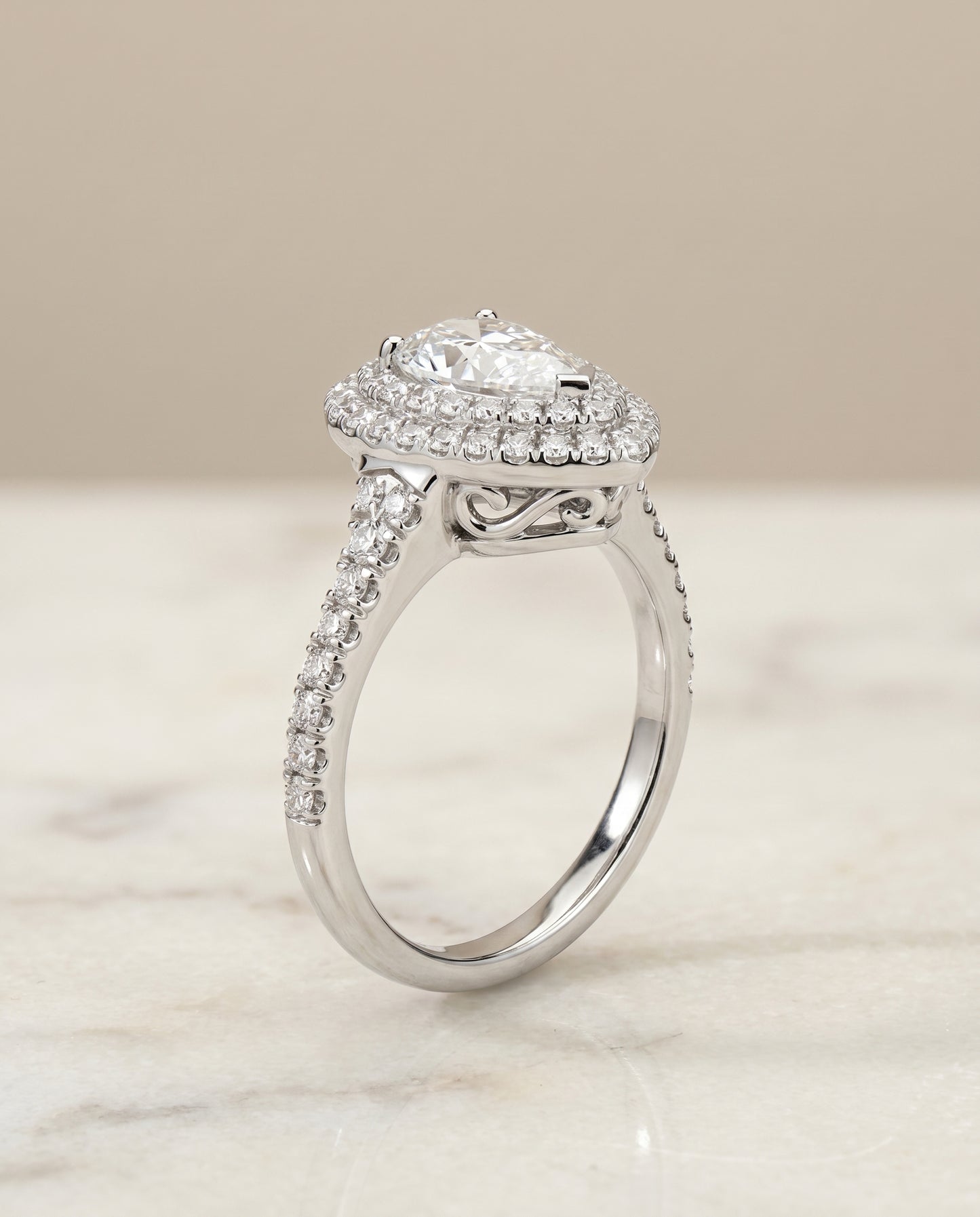 The Britney Halo Engagement Ring Setting for Pear Diamonds in 18K White Gold