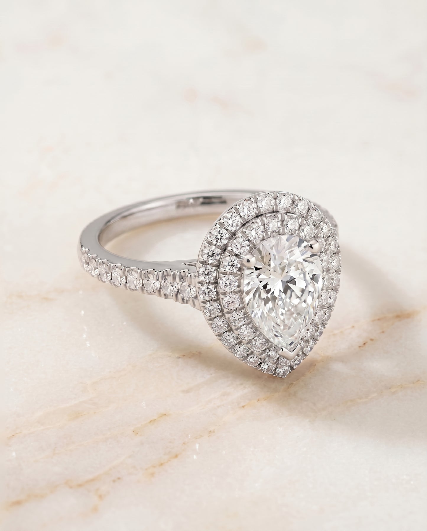 The Britney Halo Engagement Ring Setting for Pear Diamonds in 18K White Gold