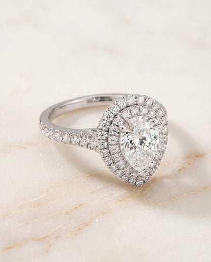 Britney Select Double Halo Pear Lab Diamond Engagement Ring in Platinum, shown on hand, angled | RockHer